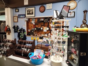 Jewelry and collectibles for sale at the front counter of the E-Mart.